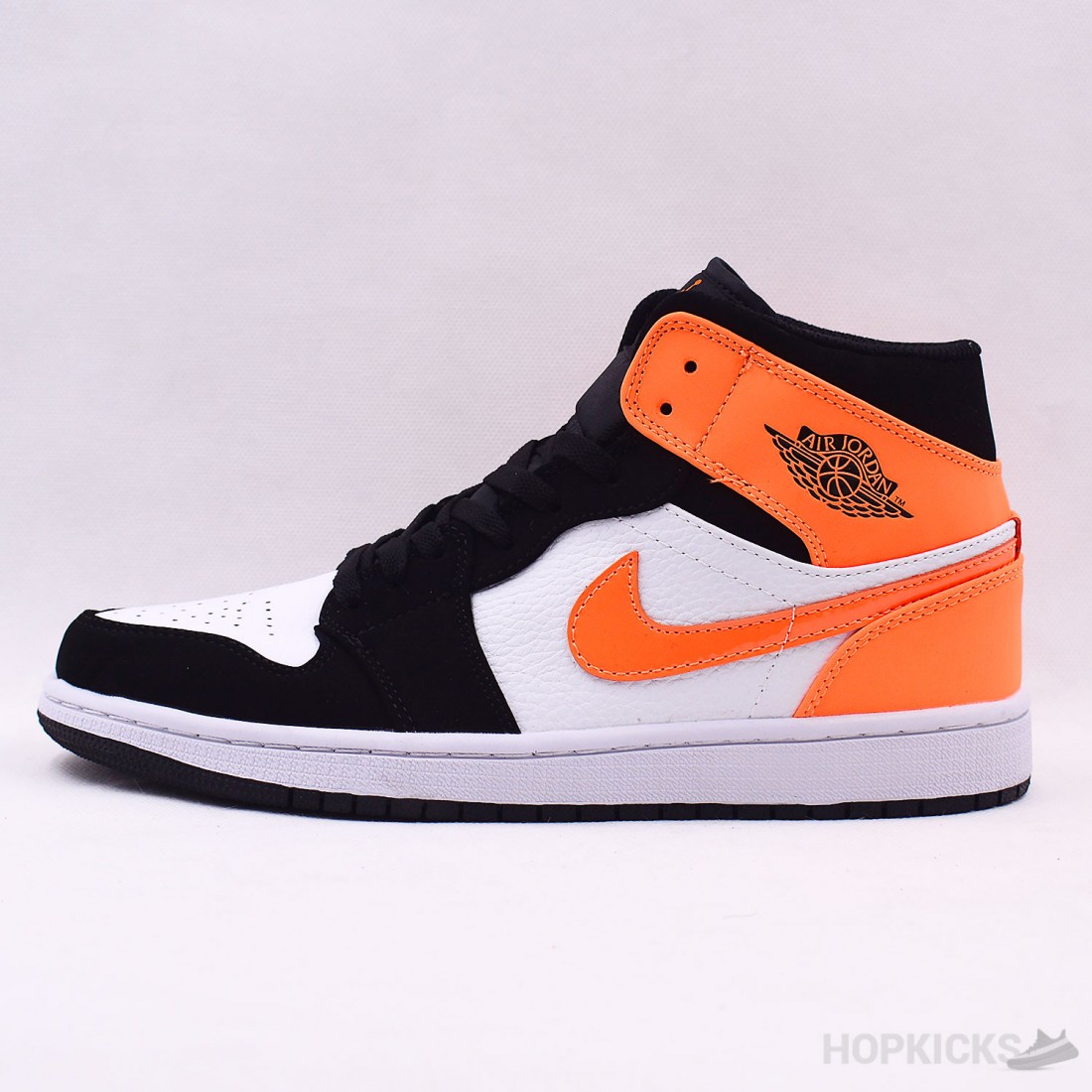 Nike air jordan 1 mid black starfish white best sale